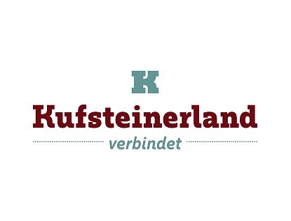 Logo mit stilisiertem "K" in Türkis oben, darunter der Text "Kufsteinerland verbindet" in rot und grün auf weißem Hintergrund.