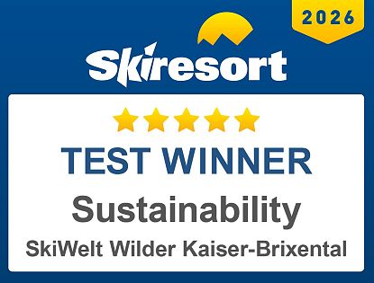 Skisports logo for 2026, highlighting SkiWelt Wilder Kaiser-Brixental as the test winner for sustainability with a five-star rating.
