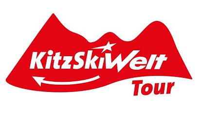 Rood en wit logo met gestileerde bergen en tekst 'KitzSkiWelt Tour'. Geschikt voor een skigerelateerd evenement of toer.