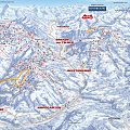 Skigebietkarte mit Pisten und Liften, umrahmt von schneebedeckten Bergen. Markierungen für Widau, Brixen und Westendorf sichtbar.